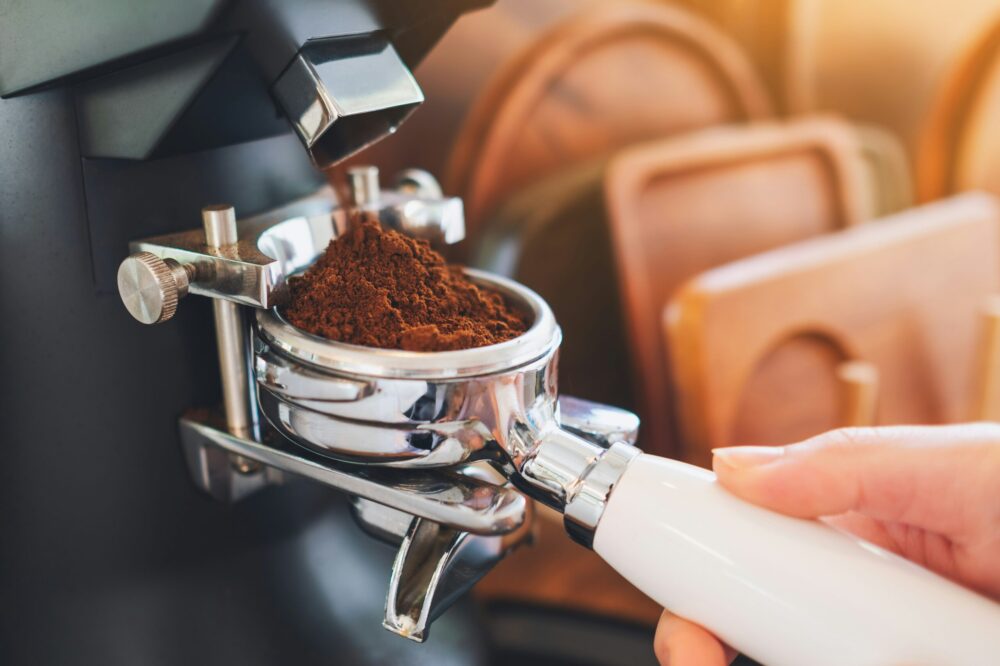Grinding espresso grounds in portafilter